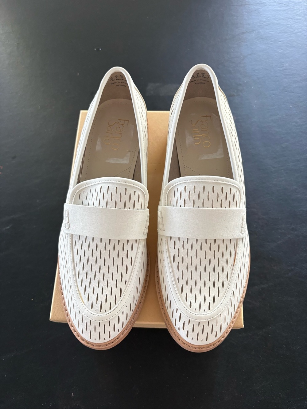 Franco Sarto white perforated loafer.